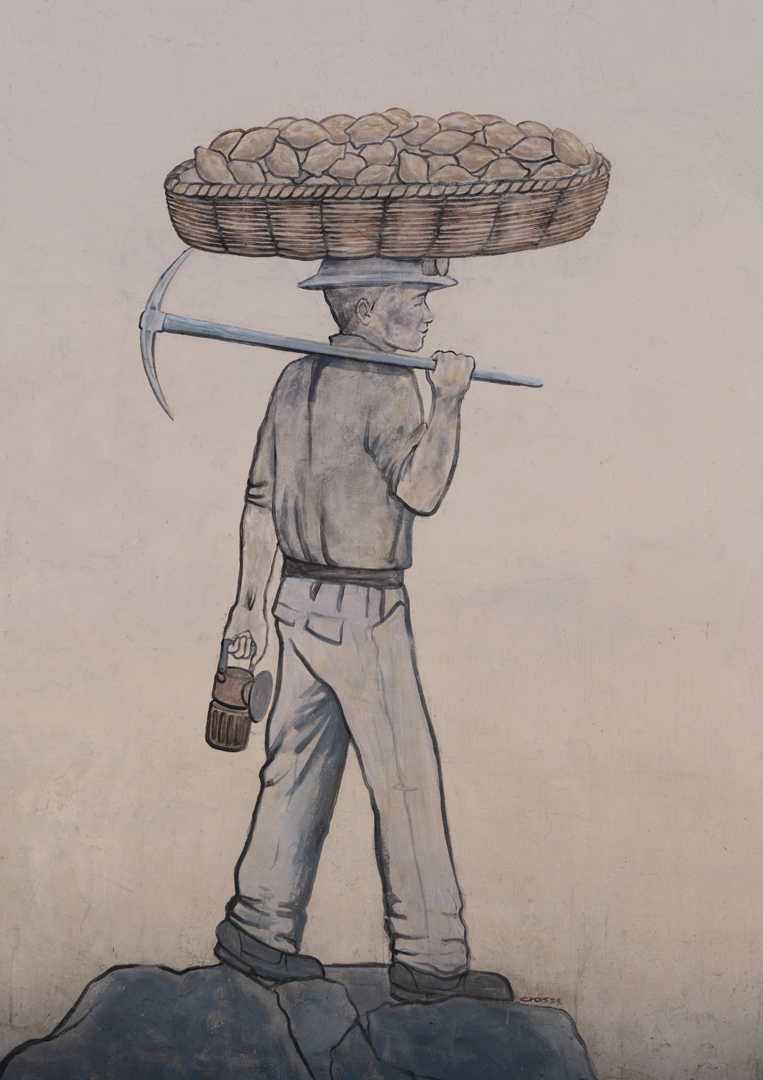 Wall art outside a paste shop in Real del Monte depicting the twin themes of mining and pastes